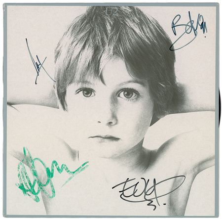 Lot #7547 U2 Signed Album - Image 1