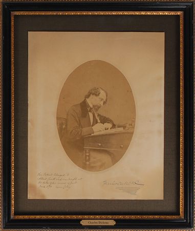 Lot #415. Charles Dickens: Striking oversized 1858 portrait of the author hard at work