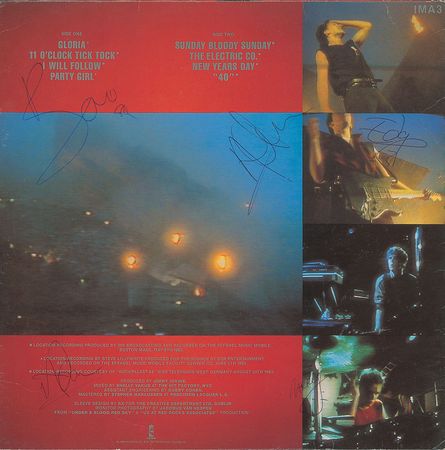 Lot #7324 U2 Signed Album - Image 1