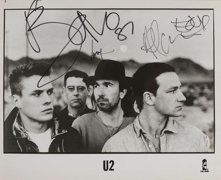 Lot #7326 U2 Signed Photograph - Image 1