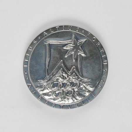 Lot #9144 Albertville 1992 Winter Olympics Chrome Participation Medal - Image 1