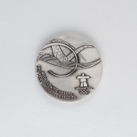 Lot #9168 Vancouver 2010 Winter Olympics Participation Medal - Image 1