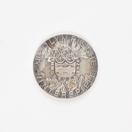 Lot #9601  Innsbruck 1976 Winter Olympics Silvered Bronze Participation Medal - Image 2