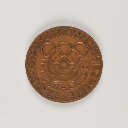 Lot #3130  Innsbruck 1964 Winter Olympics Bronze Participation Medal - Image 1