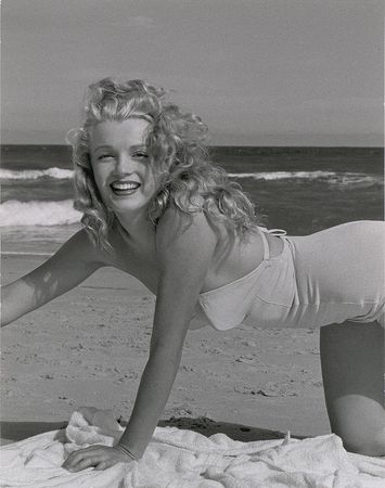 Lot #806 Marilyn Monroe: de Dienes portrait of Monroe in a stunning white swimsuit - Image 1