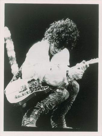 Lot #6025  Prince Original Photograph Crouching on Stage - Image 1