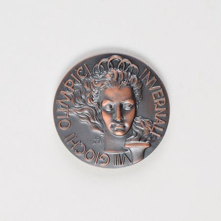 Lot #3067  Cortina 1956 Winter Olympics Bronze Participation Medal - Image 1