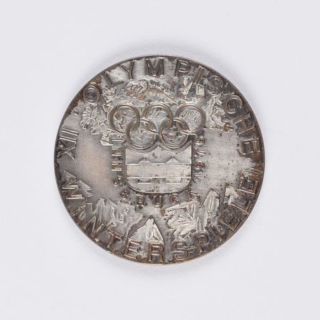 Lot #906 Innsbruck 1976 Winter Olympics Silvered Bronze Participation Medal Participation Medal - Image 1
