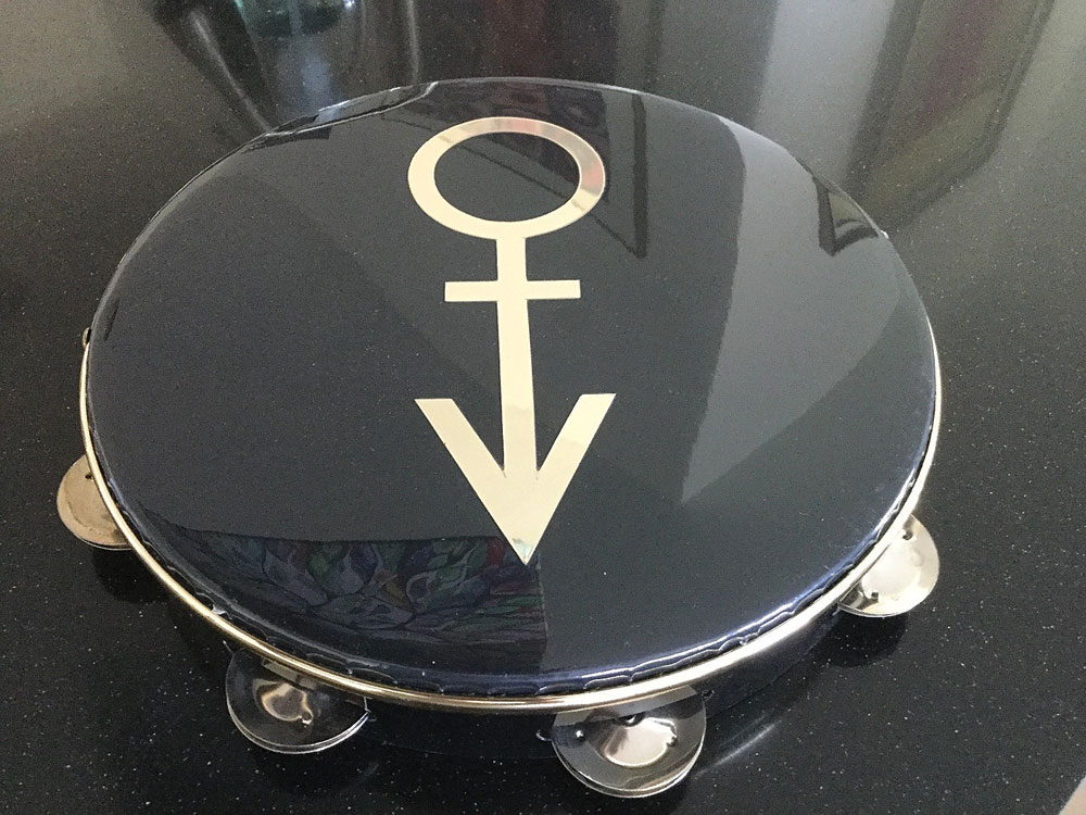 Prince's Stage-Used Black 'Symbol' Tambourine | RR Auction