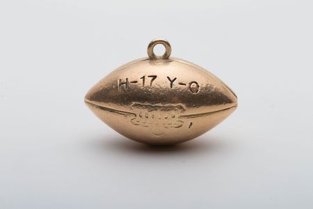 Lot #9440 John Yovicsin's 1966 Harvard vs. Yale and Ivy League Championship Charms - Image 1