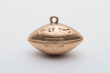 Lot #9439 John Yovicsin's 1961 Harvard vs. Yale and Ivy League Championship Charms - Image 1