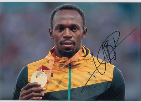 Lot #1067 Usain Bolt Signed Photographs - Image 1