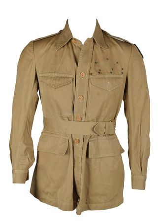 Lot #306 Chinese-Made Field Jacket Belonging to George L. Paxton of the A.V.G. 'Flying Tigers': Significant khaki field jacket with rare AVG 'Flying Tiger' patch - Image 1