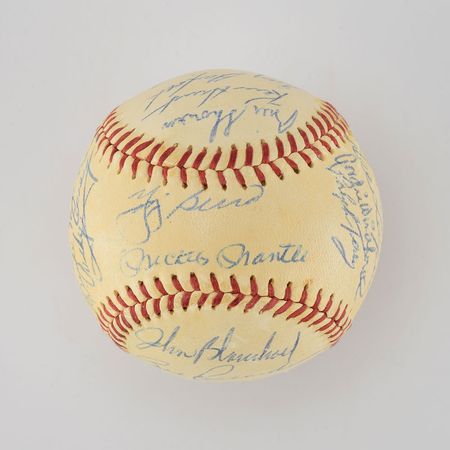 Lot #8254  1959 New York Yankees Team Signed Baseball with Mantle and Berra - Image 1