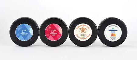 Lot #3112  Winter Olympics Group of (4) Hockey Pucks - Image 1