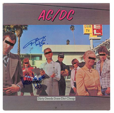 Lot #4540  AC/DC: Angus and Malcolm Young Signed Albums - Image 1
