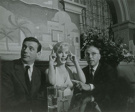 Lot #576 Marilyn Monroe, Yves Montand, and George Cukor Photograph - Image 1