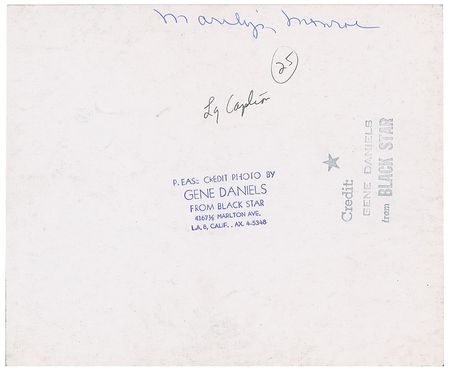 Lot #576 Marilyn Monroe, Yves Montand, and George Cukor Photograph - Image 2