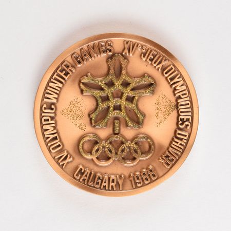 Lot #3106  Calgary 1988 Winter Olympics Bronze Participation Medal - Image 1
