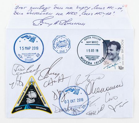 Lot #2285  Soyuz MS-10 Flown Cover Signed by 12 ISS Astronauts - Image 1