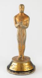 Lot #894 Columbia Pictures: Mini Oscar statuette produced by Columbia to commemorate their 1935 Academy Award success - Image 1