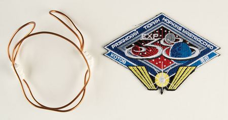 Lot #4465  Expedition 38/39 Flown Wire Tie and Patch - Image 1