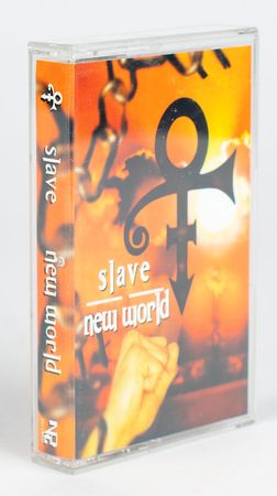 Lot #5079  Prince 'Slave / New World' Cassette Tape - Image 1