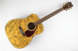 Lot #650 Music Legends: Acoustic guitar signed by over 35 notable musicians, as well as Jimmy and Rosalynn Carter - Image 1