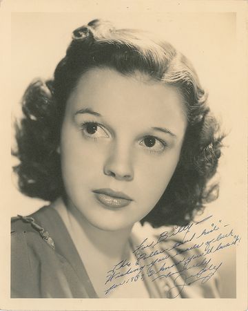 Lot #544 Judy Garland: Presented to a 'munchkin' from the Wizard of Oz, a gorgeous 1939 Garland portrait - Image 1