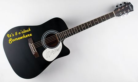 Lot #667 Jimmy Buffett Signed Guitar - Image 1