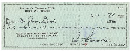 Lot #79 George Bush: As chairman, Bush signs over a check 