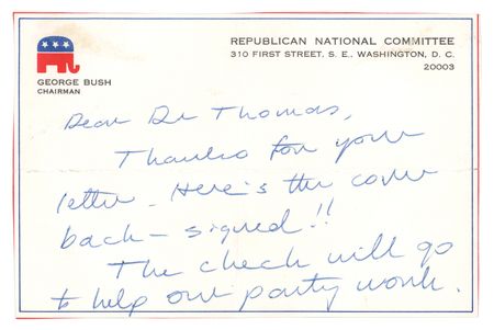 Lot #79 George Bush: As chairman, Bush signs over a check 