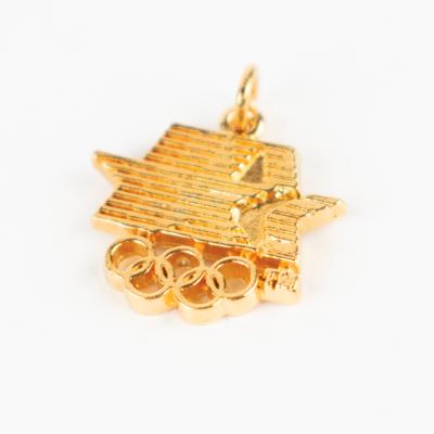 Lot #6122 Los Angeles 1984 Summer Olympics Volunteer Participation Medal and (6) Gold Logo Charms - Image 4