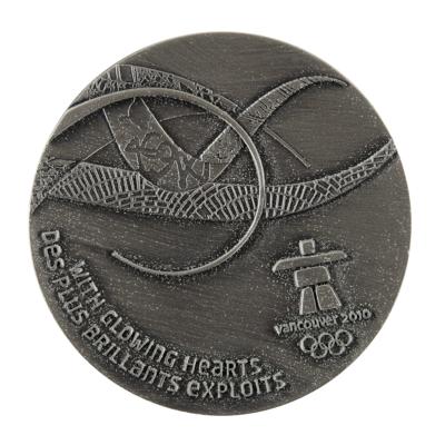 Lot #4114 Vancouver 2010 Winter Olympics Silvered Participation Medal - Image 1
