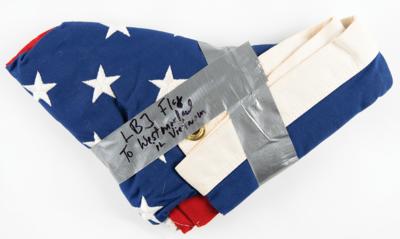 Lot #25 Lyndon B. Johnson: President Johnson extends a Capitol-flown flag to the commander of American forces in Vietnam?