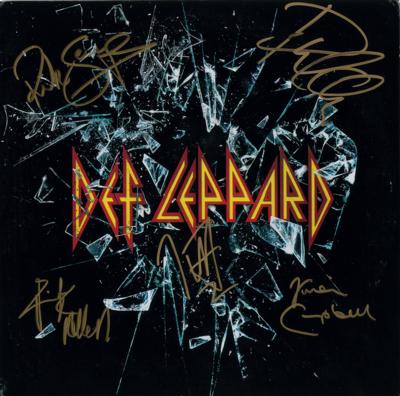 Lot #8390 Def Leppard Signed Album - Image 1
