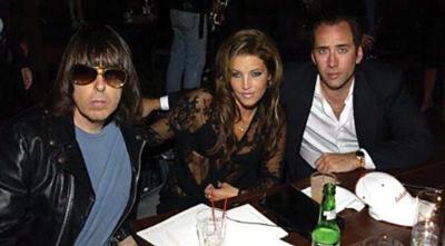 Lot #3400 Johnny Ramone Signed Clock Face Inscribed to Nicolas Cage - Image 2