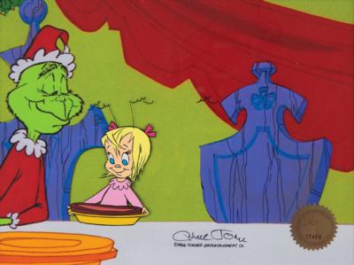 Lot #336 Cindy Lou Who production cel from Dr. Seuss' How the Grinch Stole Christmas: Scarce animation cel of Cindy Lou Who with her Grinch-carved 'roast beast,' signed by director Chuck Jones - Image 1