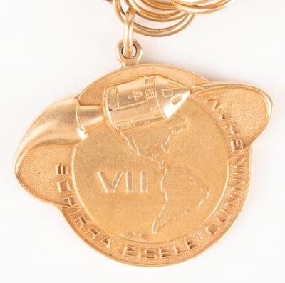 Lot #7006 Jo Schirra's Mercury-Apollo Charm Bracelet including (4) Flown Charms, with Rare Gold Apollo 7 Robbins Medallion - Image 1