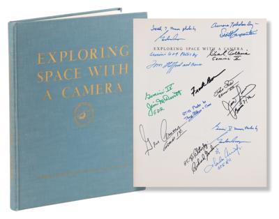 Lot #358 Astronauts Multi-Signed (12) Book - 'Exploring Space with a Camera' - Image 1
