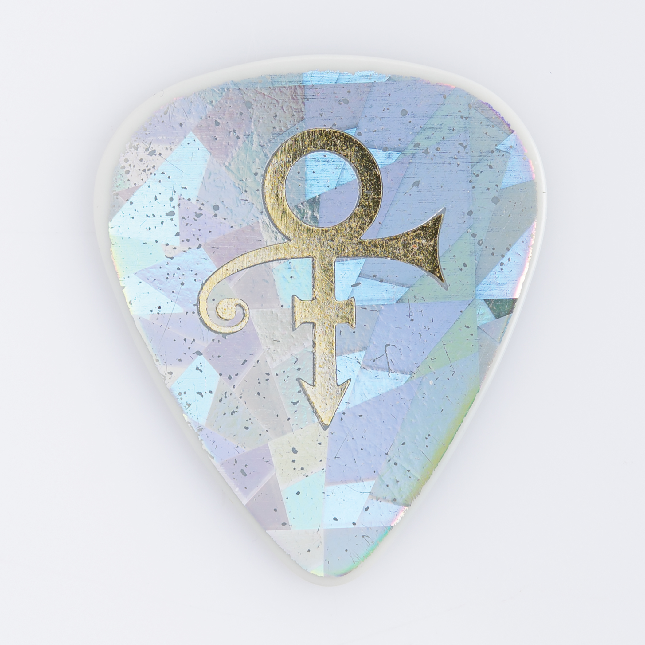 Lot #486 Prince's Stage-Used Holographic 'Love Symbol' Guitar Pick Guitar Pick - Image 1