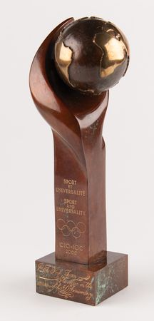 Lot #3293 International Olympic Committee (IOC) 'Sport and Universality' Marble-and-Bronze Sculpture Award by Rosa Serra - Image 1
