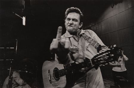 Lot #7215 Johnny Cash at San Quentin Oversized 'Middle Finger' Photograph Signed by Jim Marshall - From the Collection of Photographer Barry Feinstein - Image 2