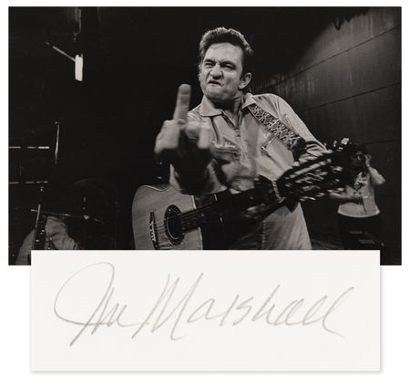 Lot #7215 Johnny Cash at San Quentin Oversized 'Middle Finger' Photograph Signed by Jim Marshall - From the Collection of Photographer Barry Feinstein - Image 1