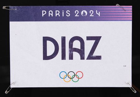 Lot #3388 Paris 2024 Summer Olympics (2) Items - Competitor's Bib and Opening Ceremony Marching Pass - Image 1