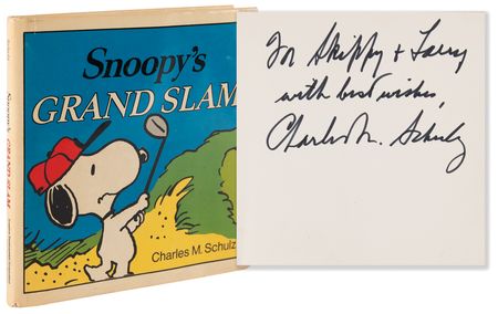 Lot #621 Charles Schulz Signed Book - Snoopy's Grand Slam - Image 1