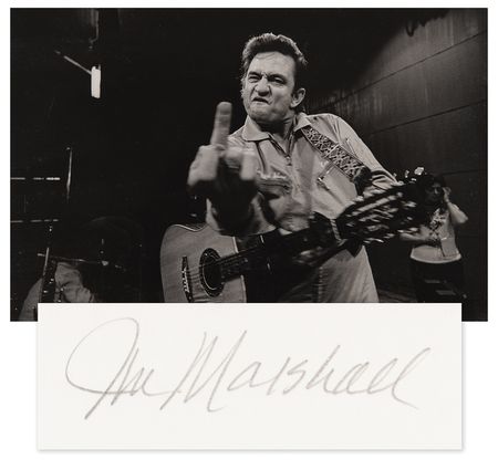Lot #647 Johnny Cash at San Quentin Oversized 'Middle Finger' Photograph Signed by Jim Marshall - From the Collection of Photographer Barry Feinstein - Image 1