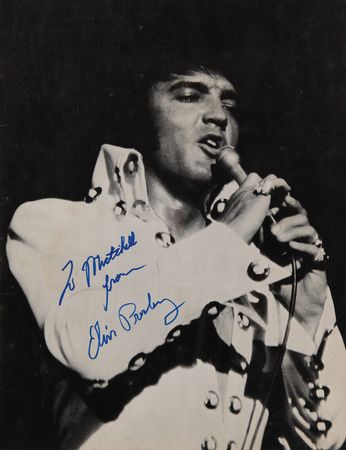 Lot #702 Elvis Presley Signed 'Tour Photo Album’ Program (1972) - Image 1