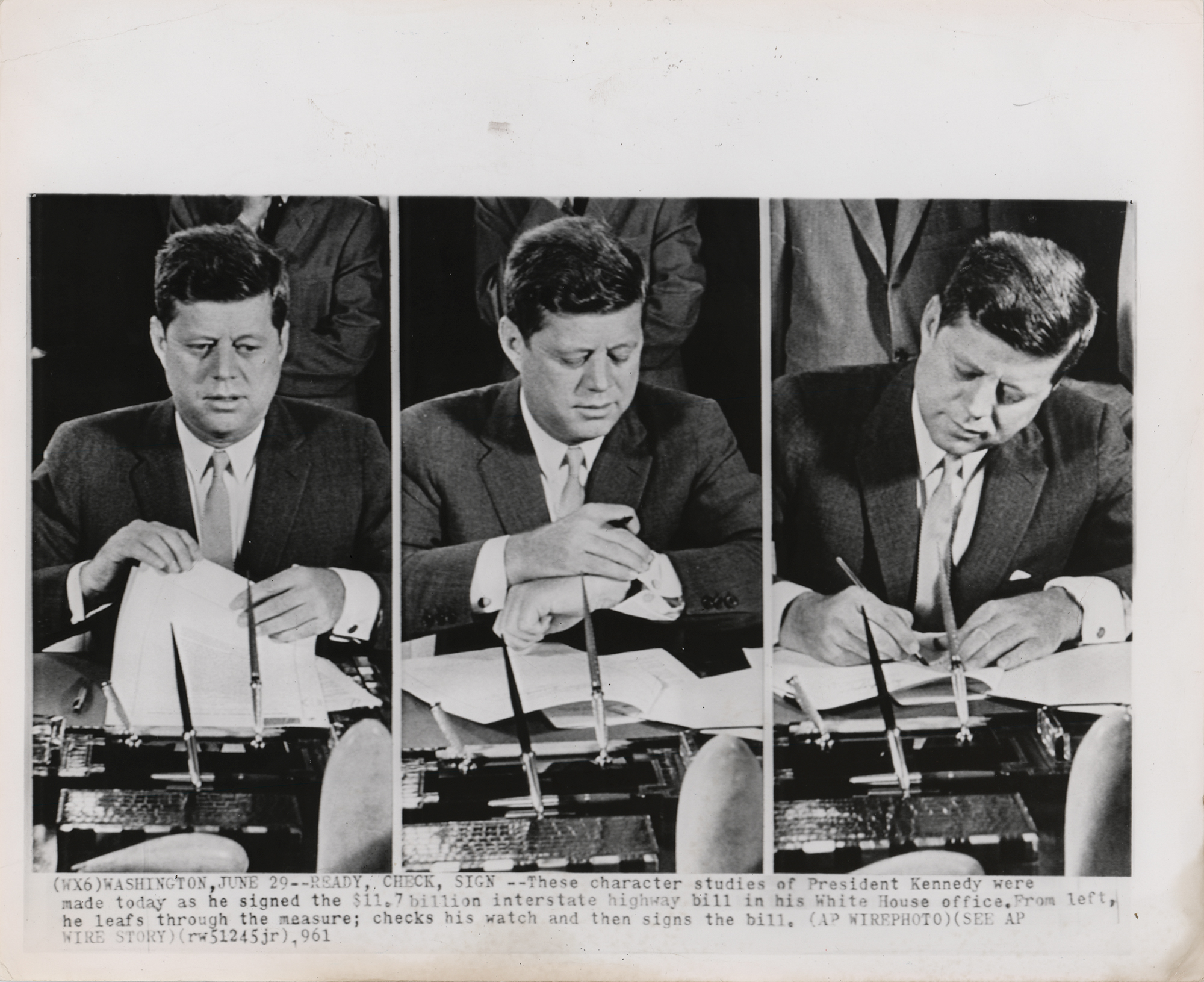 Lot 131 John F. Kennedy 1961 Original Wirephoto - Signing Interstate Highway Bill