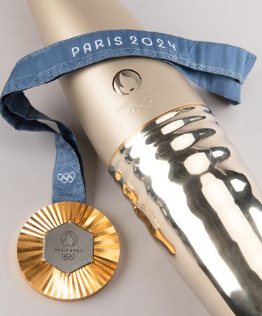 Lot #3120 Paris 2024 Summer Olympics Gold Winner's Medal, Torch, and Poster - Image 1